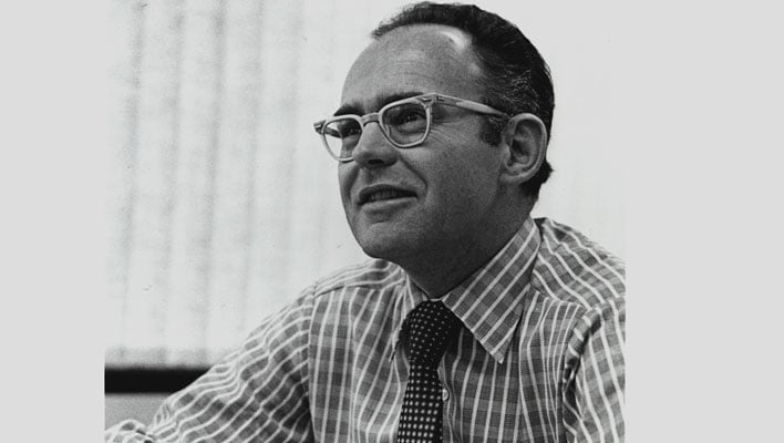 An older black and white photo of Gordon Moore.