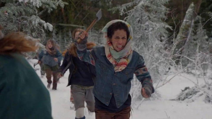 The teenage ladies running in the wilderness in a scene from Yellowjackets.