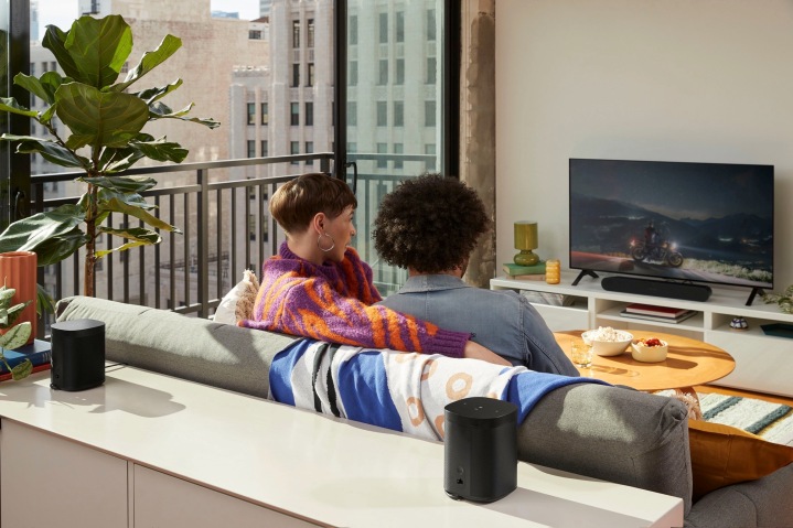 Leaked publicity photo of a new Sonos soundbar seen in a home theater arrangement with Sonos One or One SL speakers as the surround channels.