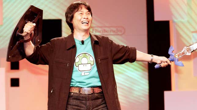 Miyamoto holds the Mastersword on stage. 