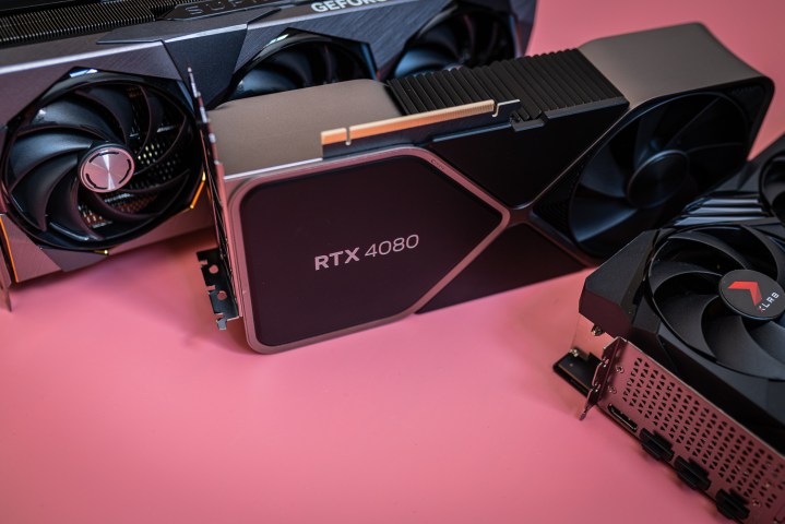 Three RTX 4080 cards sitting on a pink background.