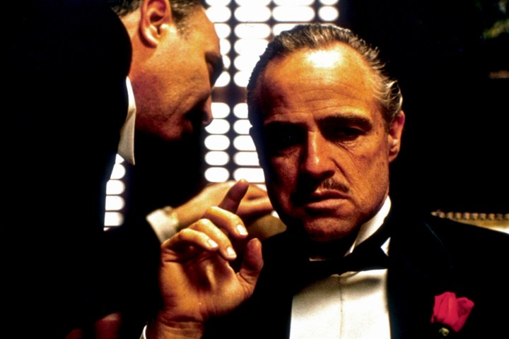 Marlon Brando listens to counsel in a scene from The Godfather.