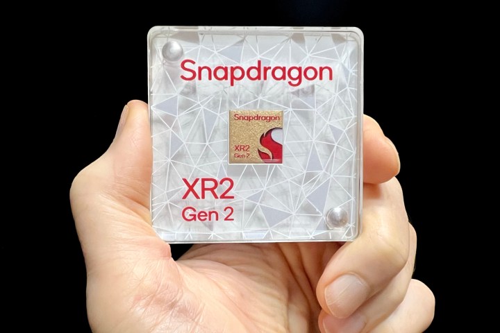 Alan Truly holds a display model of Qualcomm's Snapdragon XR2 Gen 2 chip.