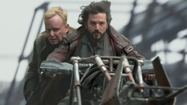 Cassian riding off with Luthen on a speeder in Andor.